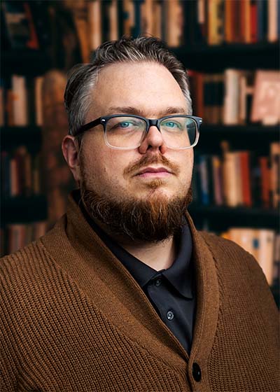 A photo of author Colin Finkle in a library.