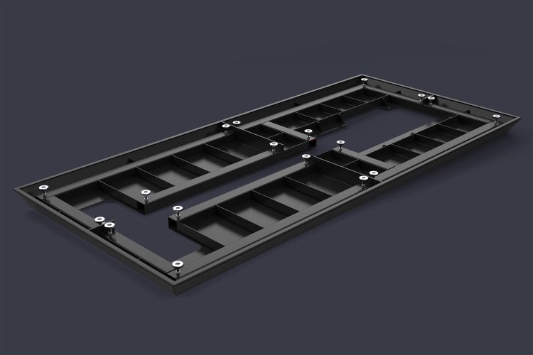 Bottom view of a black steel quadrant frame from the Canadian Tire eBike Demo Platform, precision‑fabricated with laser‑cut panels, levelers, and structural supports, designed to assemble around a roller trainer while remaining lightweight, modular, and strong enough to support riders during in‑store test rides.