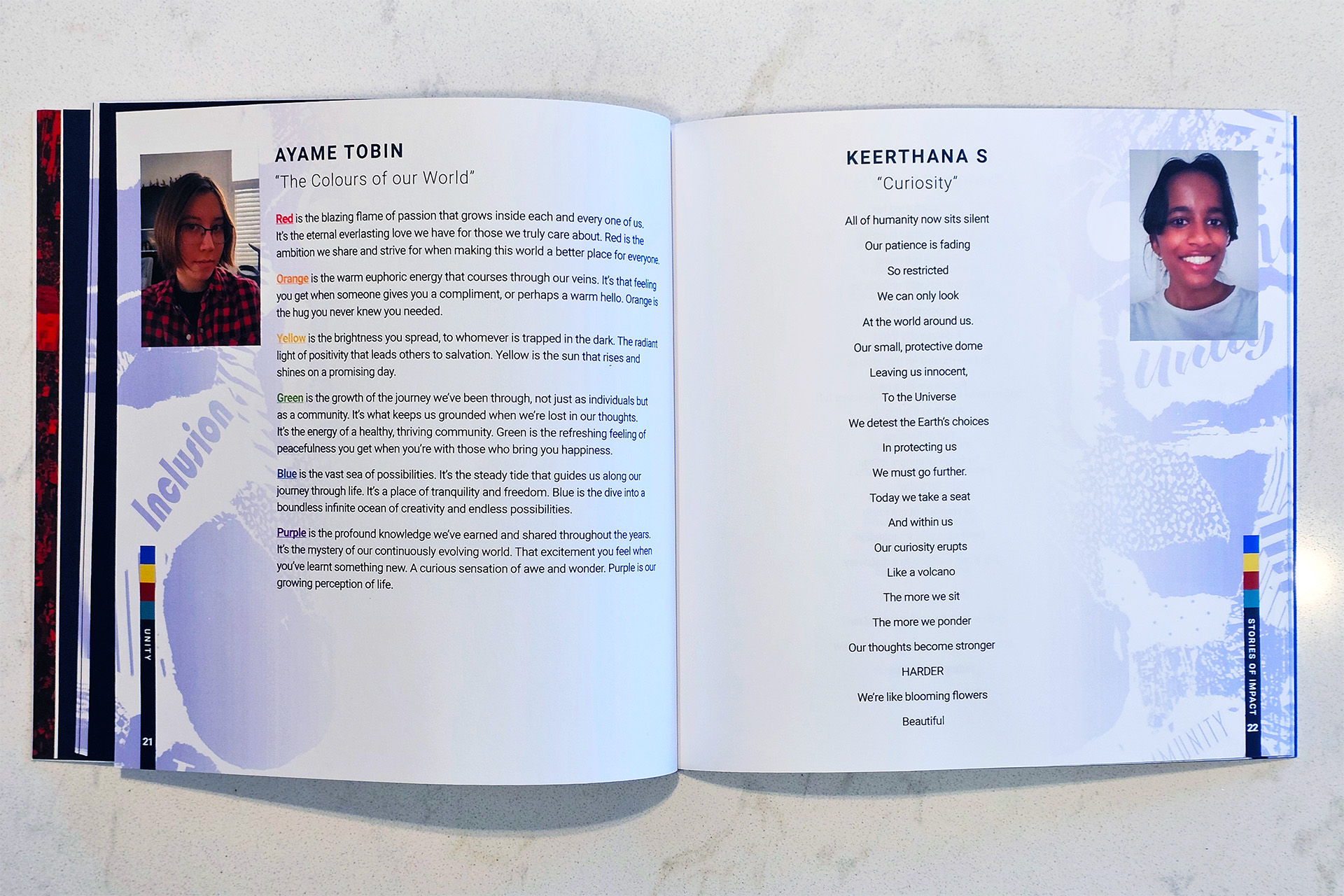 Open book with two creative writing pieces, “The Colours of our World” and “Curiosity,” each with author portraits.